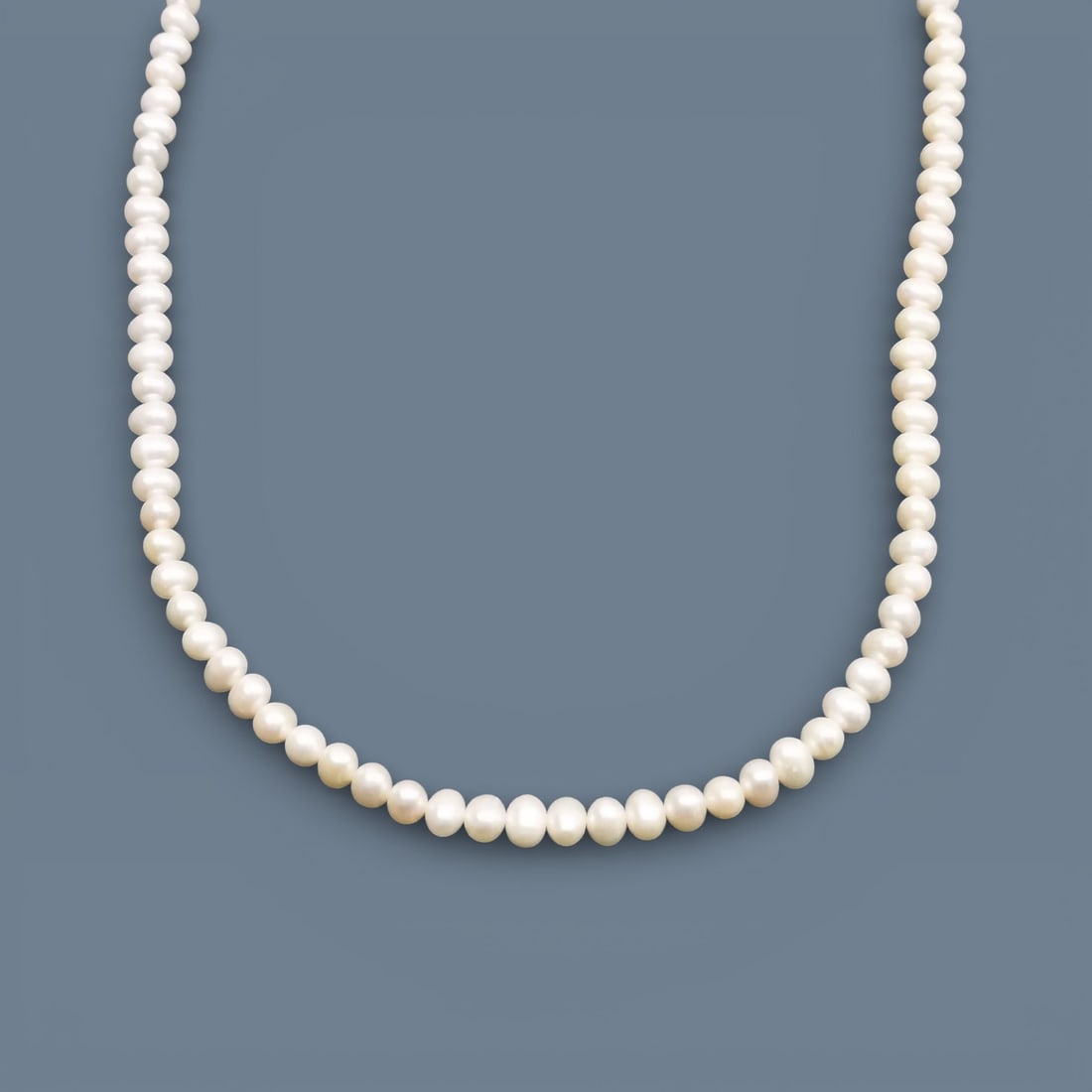 Freshwater Pearl Opera Length Necklace Approx. 48 inches /120cm Sterling Silver Clasp: Long strand freshwater pearl necklace composed of uniformly sized round pearls arranged continuously along the strand. Pearls presenting soft luster and natural surface characteristics. Necklace termi