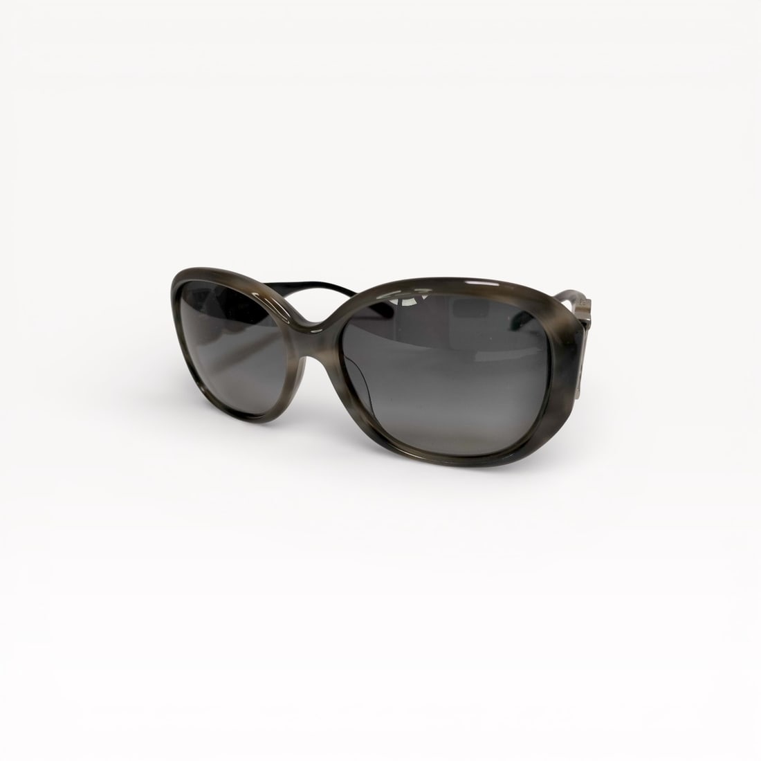 Chloé Oversized Gradient Lens Sunglasses: Authentic Chloé sunglasses featuring an oversized rounded frame design in translucent dark-toned acetate. Fitted with gradient gray lenses and finished with sculptural metal hinge accents at th