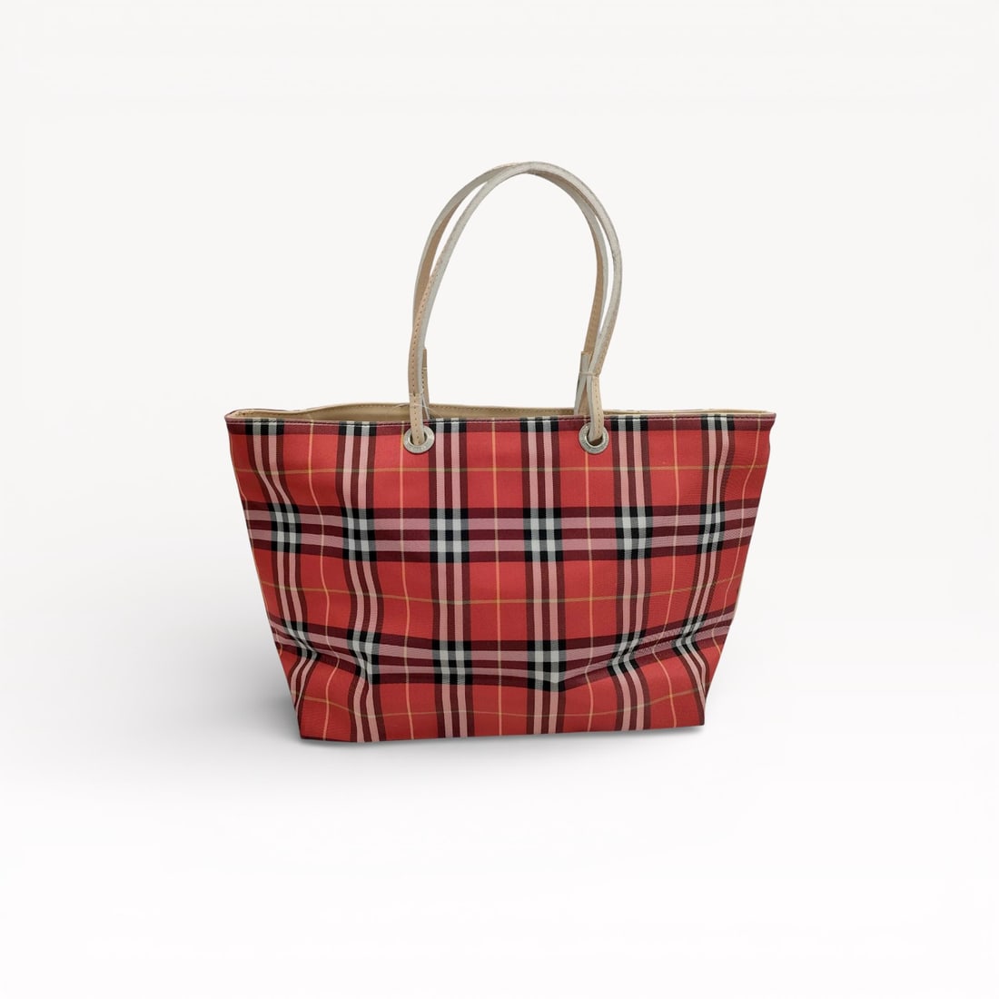 Burberry Red Nova Check Canvas Tote Bag with Leather Trim: Authentic Burberry tote bag in red Nova Check canvas with light leather trim. The design features dual shoulder straps threaded through metal grommets, a structured open-top silhouette, and a flat bas