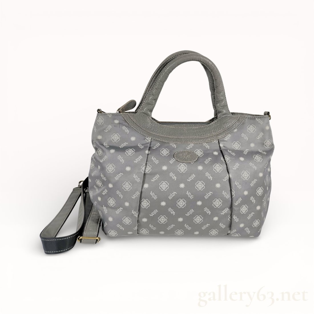 Ibiza Nylon Leather Tote Handbag: Authentic Ibiza tote handbag, having a nylon body and leather trim. Featuring double top handles and a top zip closure. Interior comprising a single compartment with a small zip pocket. Exterior showi