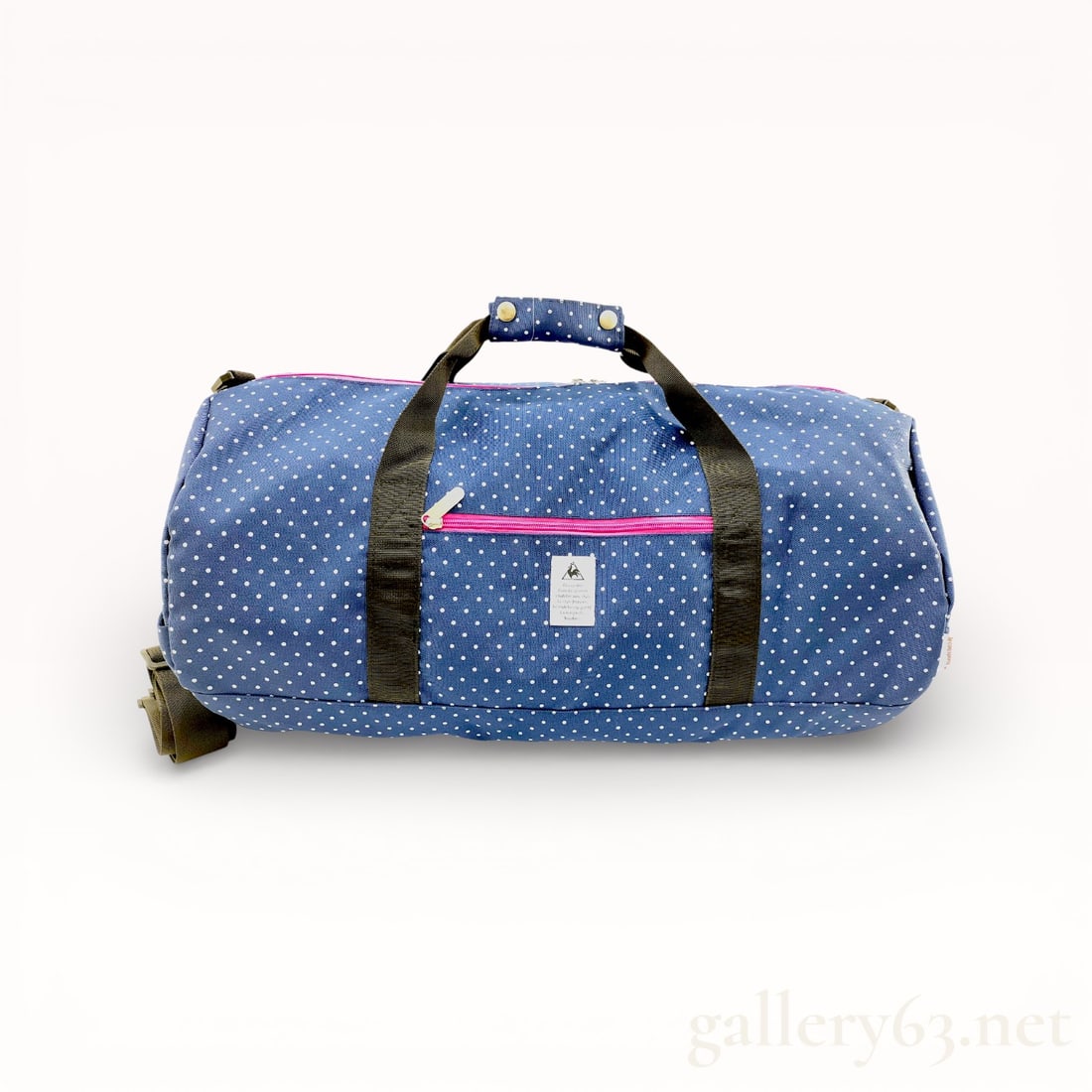 LeCox Sportif Travel Dot Pattern Navy Pink Boston Bag: Authentic LeCox Boston Bag , having a rectangular form, this LeCox Sportif travel bag features a navy background with white dot pattern across the exterior. Comprising a top zipper closure, dual