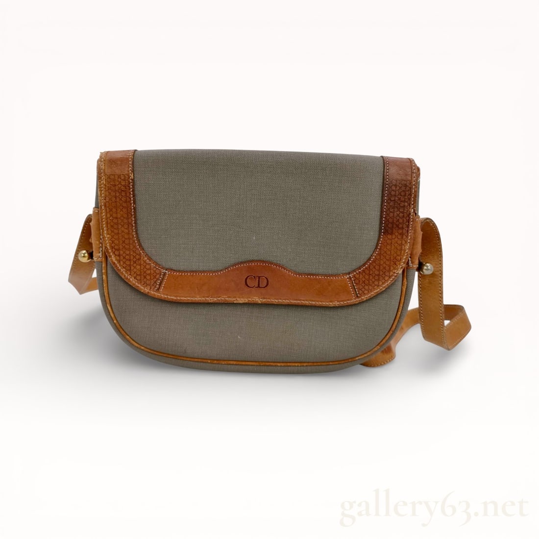 Dior PVC Leather Shoulder Bag: Authentic Dior shoulder bag having a rectangular silhouette, constructed in PVC with leather trim. Featuring a flap closure with magnetic metal connection, set with a leather shoulder strap. Exterior