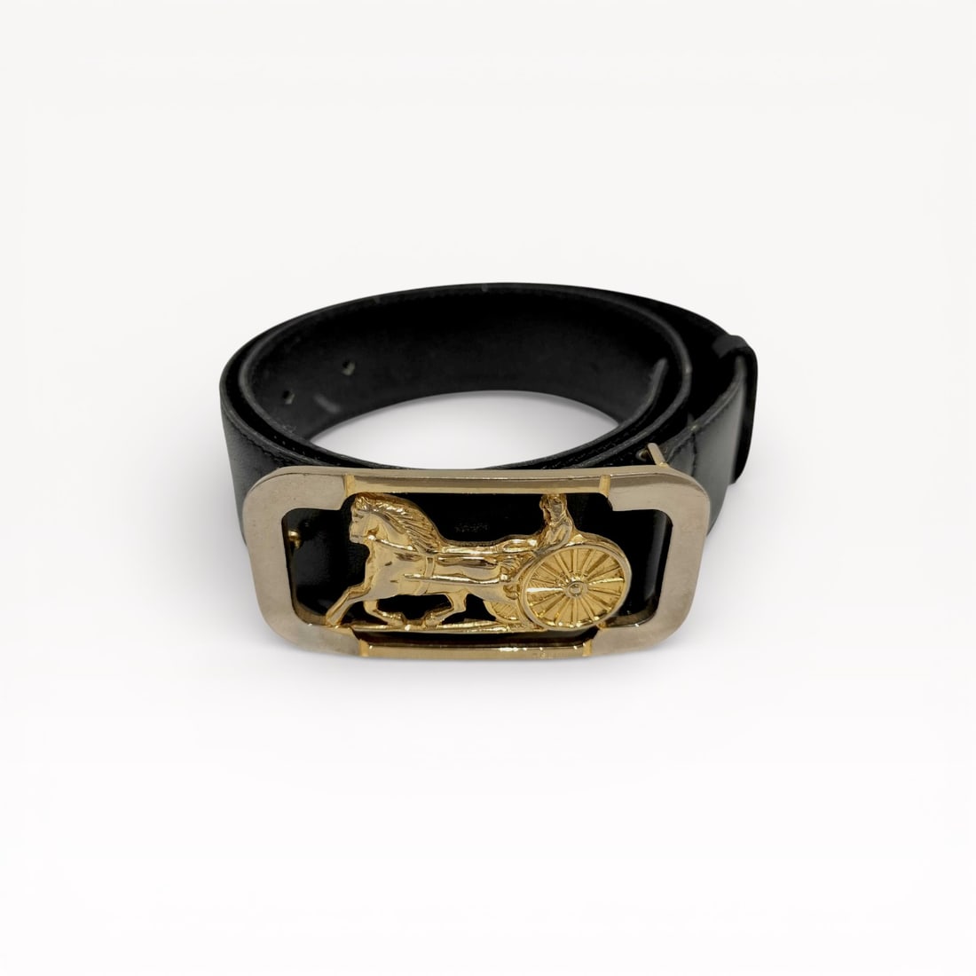 Celine Carriage Fittings Gold Buckle Leather Belt: Authentic CELINE belt featuring the iconic Carriage fittings buckle in gold-tone hardware. Crafted with a smooth black leather strap, this belt showcases a bold rectangular frame with the signature ca