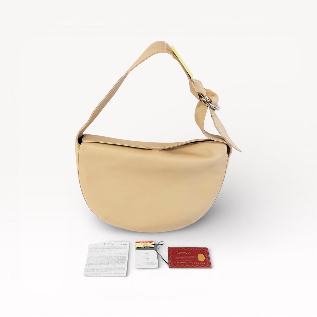 Cartier Trinity Leather Shoulder Bag in Beige with Ring Hardware: Authentic Cartier Trinity shoulder bag in beige leather. The design features a softly structured silhouette with a wide leather shoulder strap secured by signature interlocking ring hardware in mixed