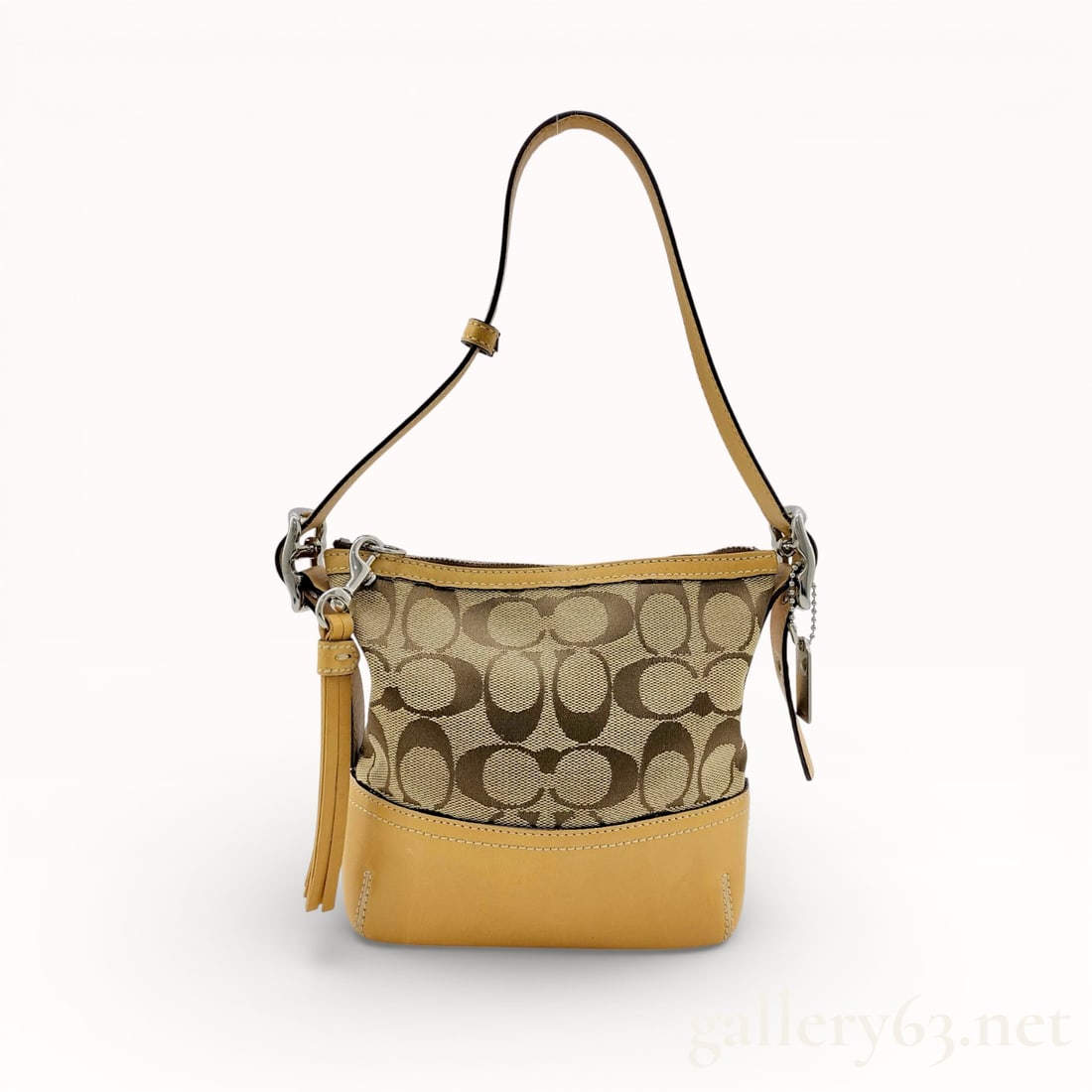 Coach Signature Mini Handbag Pouch: Authentic Coach Signature mini handbag pouch, having a rectangular form and zip-top closure. Exterior featuring coated canvas with a repeating “C” motif in contrasting tones. Interior comprisi