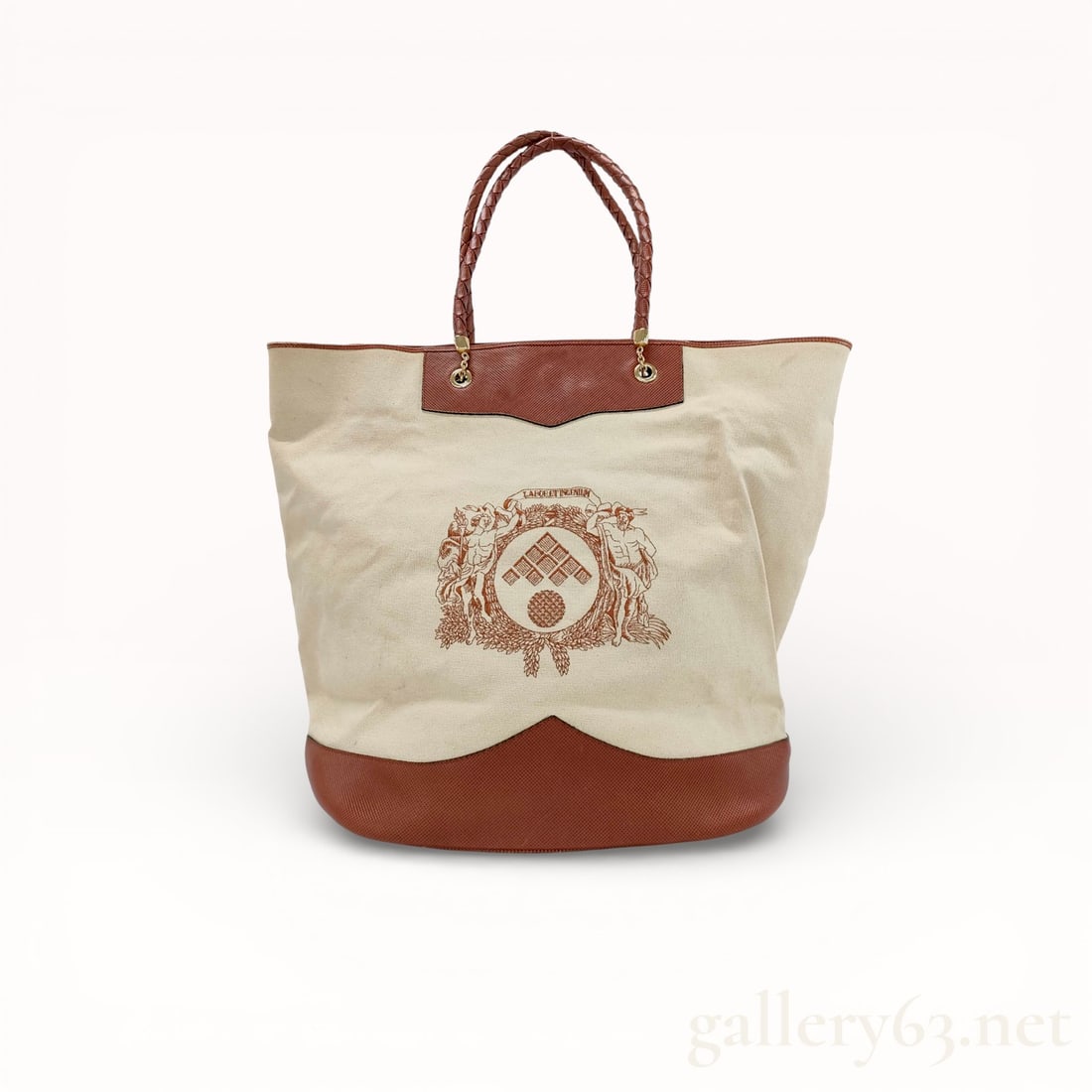 Bottega Veneta Canvas Tote Bag: Authentic Bottega Veneta tote bag, having a rectangular body constructed in canvas. Featuring dual handles set at the top. Exterior displaying a woven motif throughout. Opening at the top with a magne