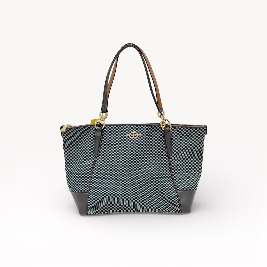 Coach Jacquard Tote Bag with Leather Trim: Authentic Coach jacquard tote bag featuring a refined woven fabric body accented with smooth leather trim and shoulder straps. Designed with a structured silhouette, gold-tone hardware, and Coach logo