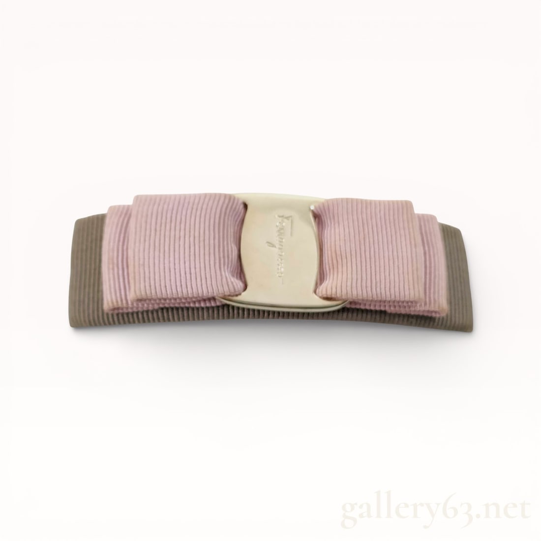 Salvatore Ferragamo Valletta Hair Clip: Authentic Ferragamo Hair clip in barrette form, featuring layered grosgrain ribbon in muted taupe and pale pink tones arranged in a bow-like configuration. Design including a polished gold central pla
