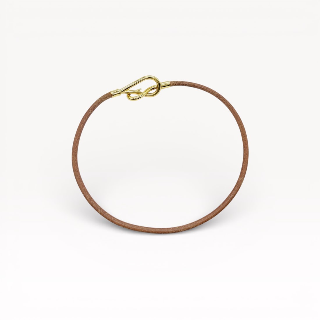 Hermès Jumbo Leather Choker necklace/double-wrap bracelet: Authentic Hermès Jumbo leather choker necklace/double-wrap bracelet with gold-tone hardware. Its versatile design allows it to be worn as a necklace or wrapped around the wrist as a bracelet. 