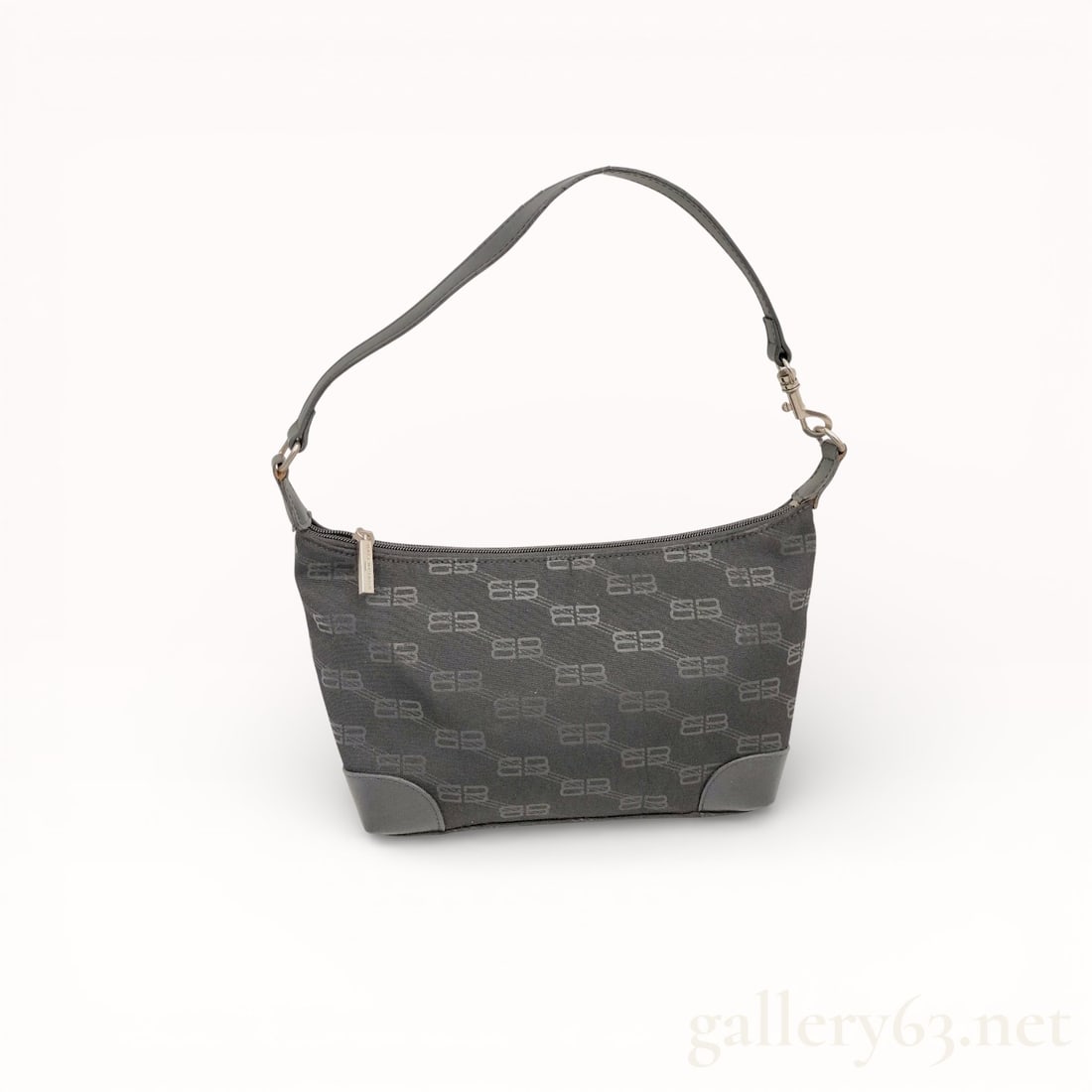 Balenciaga BB Monogram Shoulder Bag in Black Leather: Authentic Balenciaga shoulder bag in black leather. Soft hobo-style form with single shoulder strap. Minimal exterior detailing emphasizing shape and material. Interior lined and sized for daily essen