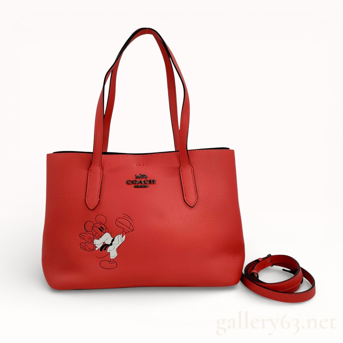 Coach x Disney Leather Tote Bag Japan Exclusive – Mickey Mouse, Excellent Condition: Authentic Coach Disney leather tote featuring a playful Mickey Mouse graphic. Crafted from smooth red leather with dual shoulder straps, detachable crossbody strap, and logo detail. Spacious interior,