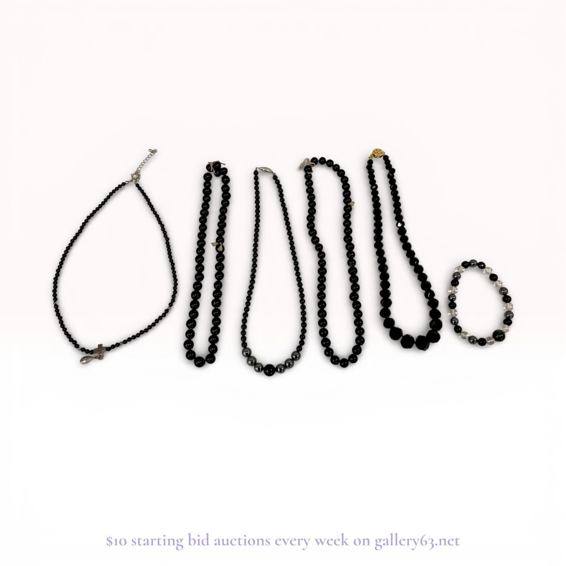 Onyx and .925 Silver Necklaces and Bracelet Jewelry Collection: Onyx jewelry collection made up of multiple necklaces and one bracelet. Group featuring strands of black onyx beads, arranged in uniform and graduated sequences. Several necklaces featuring round bead