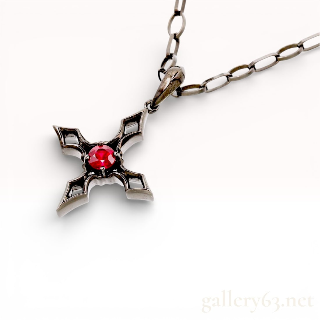 Vartix 10k White Gold .25ct Ruby Cross Pendant Necklace with box: Talk about ruby red. This is the quintessential ruby color. Just red. No pink tinge, no purple tinge, just pure ruby-slipper red here. Vartix 10k white gold necklace featuring a cross-shaped pendant a