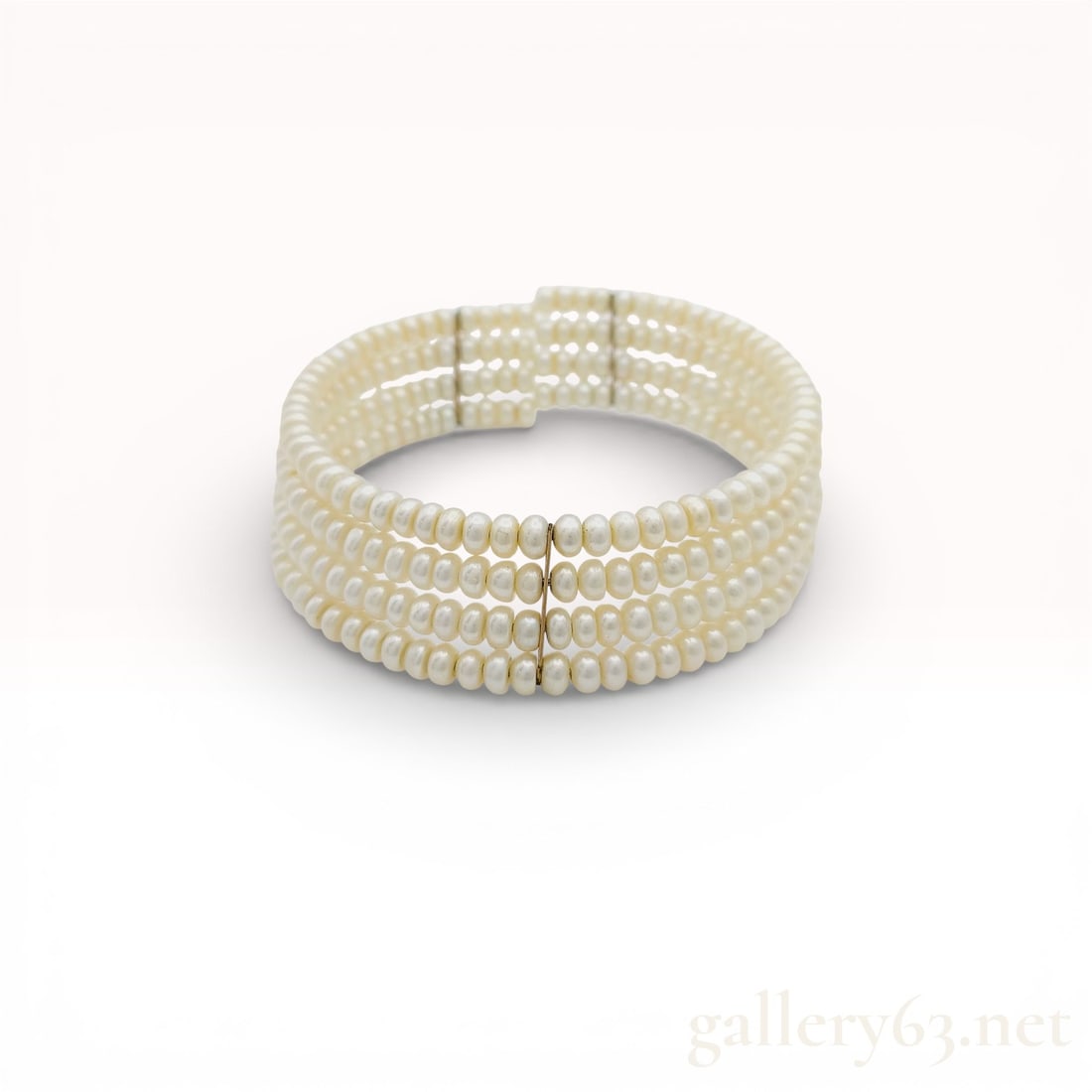 Multi-Row Semi-Round 4.4mm Cultured Pearl Bracelet: Strand bracelet featuring multiple rows of semi-round cultured pearls arranged in a wide, structured band. Pearls display soft white luster with subtle natural variation in shape and surface. Bracelet