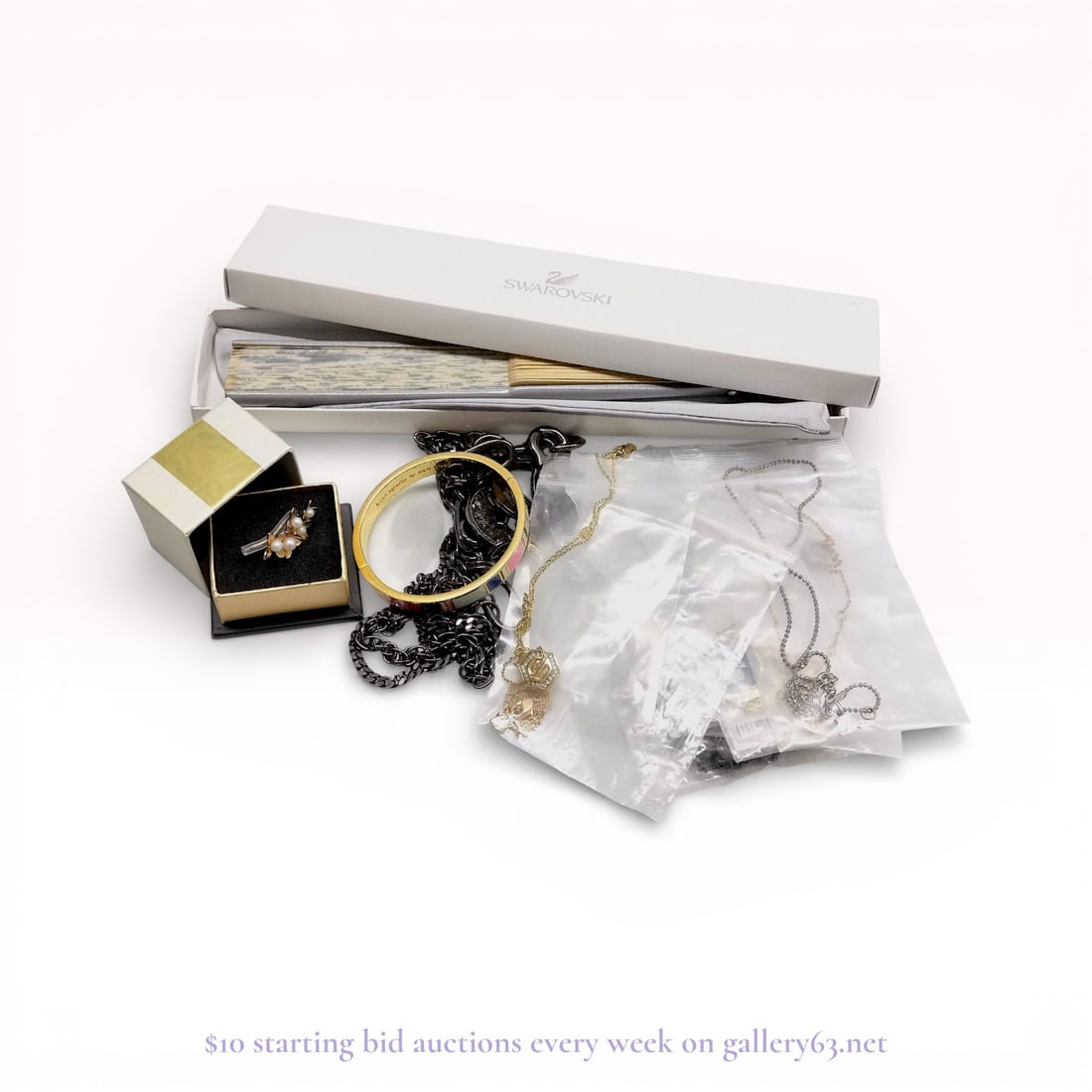 Tiffany & Co., Swarovski & Designer Jewelry Accessories 12-Piece Lot – Estate Collection: Estate lot offered as shown, including all items visible in the images. Offered as a single lot with no individual examination; contents and condition vary and may include wear, damage, or missing ele