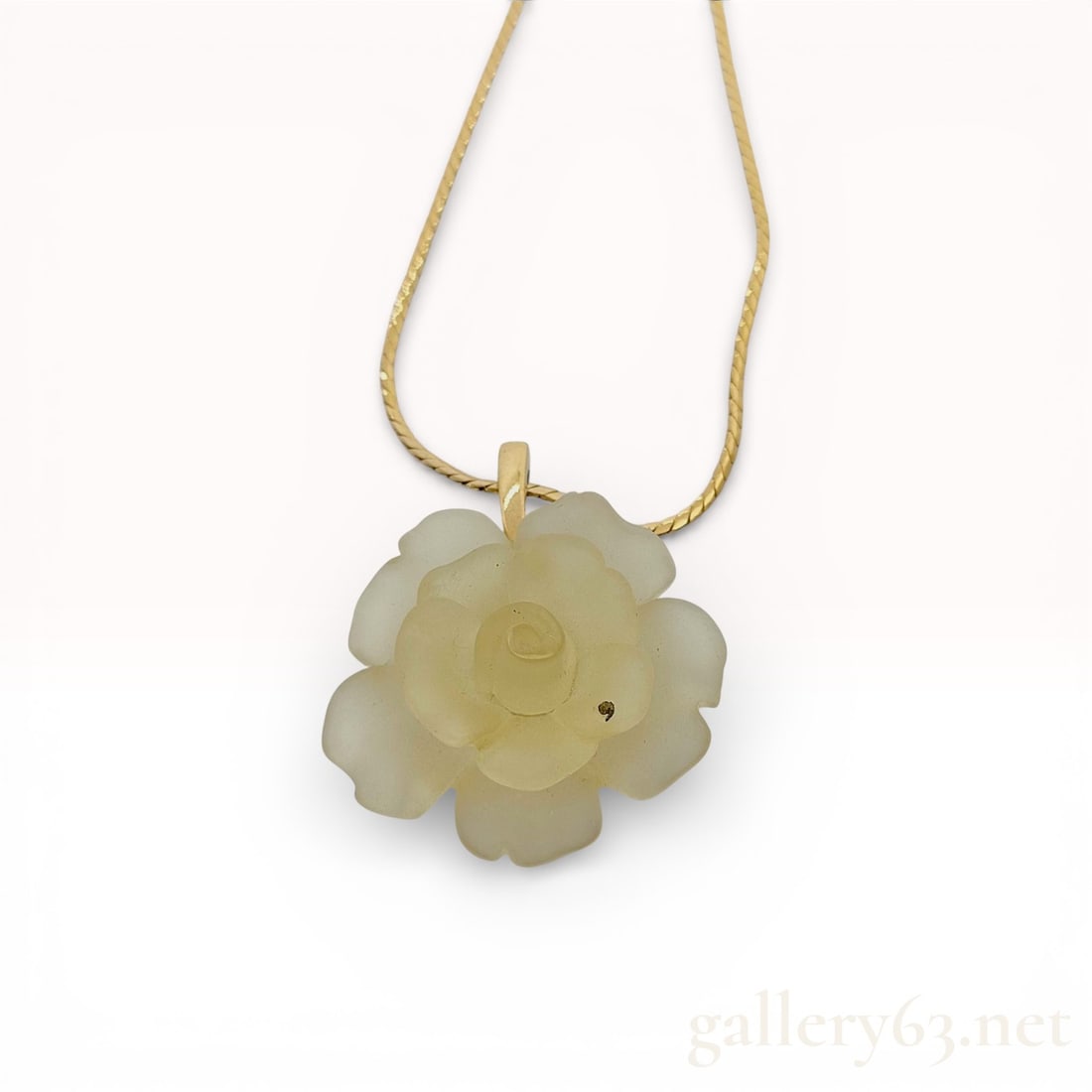 Givenchy Gold-Tone Necklace with Translucent Flower Pendant: Givenchy necklace featuring a translucent floral pendant with layered petal detailing. Pendant suspended from a fine gold-tone chain with secure clasp closure. Design presenting a soft botanical s