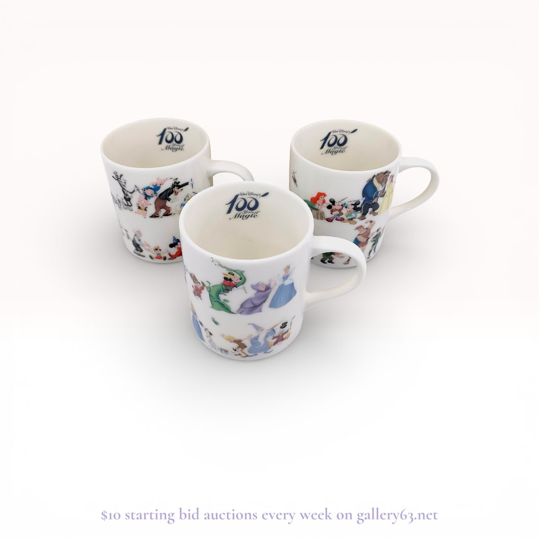 Walt Disney 100th Anniversary Trio Mug-Set With Box: Authentic Walt Disney mugs having a cylindrical form in a white glazed finish. Exterior surfaces featuring multicolor printed character illustrations arranged around the body. Interior bases displayin