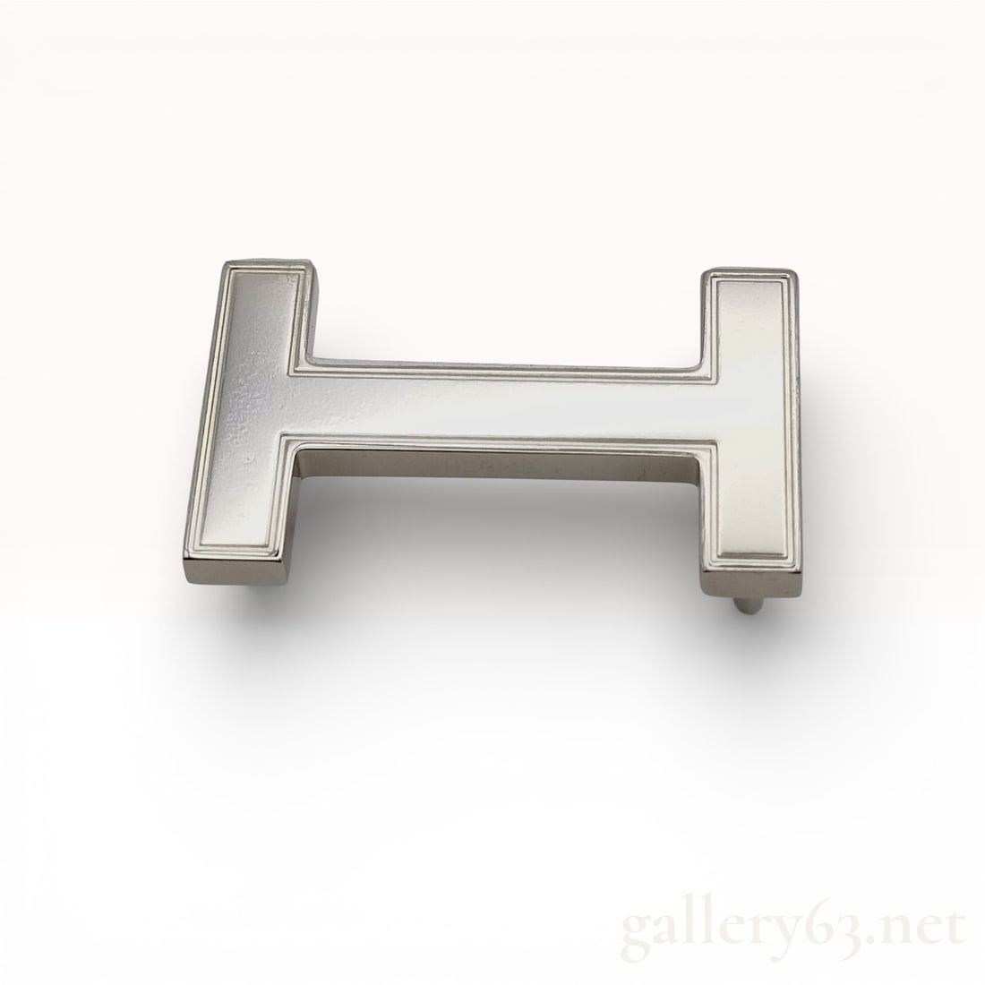 Hermès Palladium-Tone H Belt Buckle Hardware: Hermès belt buckle featuring the signature H-shaped design in palladium-tone metal. Buckle finished with a polished surface and engraved Hermès branding. Piece intended for use with