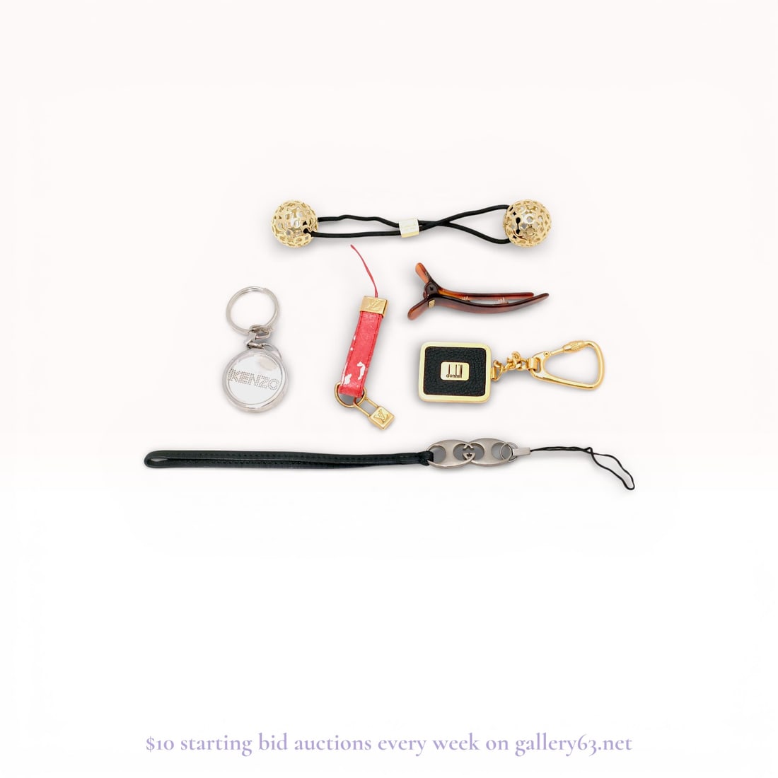 Luxury Designer Charm & Hair Accessory Lot – Louis Vuitton, Gucci, Fendi, Coach + More: Estate lot offered as shown, including all items visible in the images. Offered as a single lot with no individual examination; contents and condition vary and may include wear, damage, or missing ele