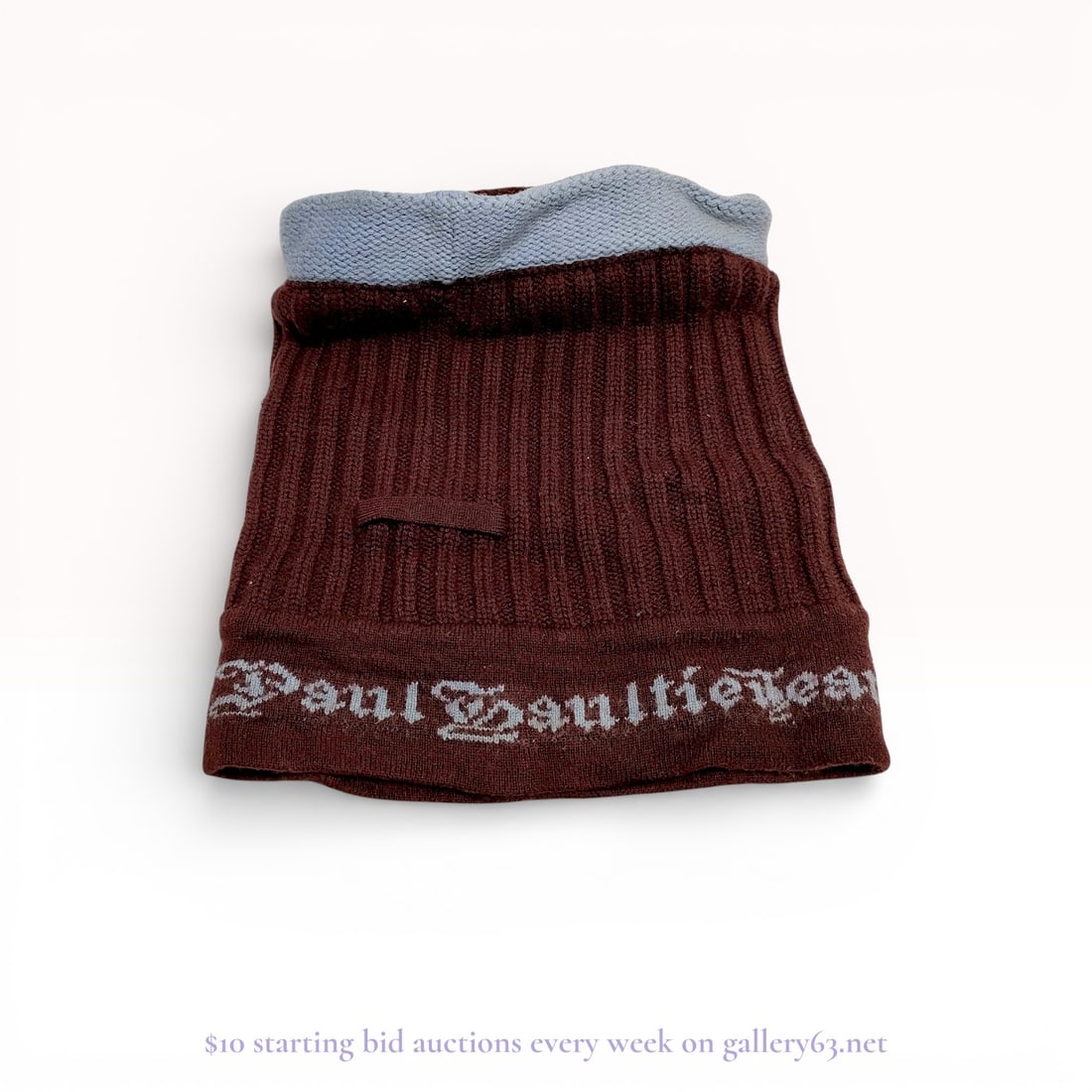 Vintage Jean Paul Gaultier Knit Neck Warmer: Authentic Jean Paul Gaultier Knit Neck Warmer featuring ribbed brown knit exterior with a contrasting light blue knit lining visible at the opening. Design including an integral knit logo band reading