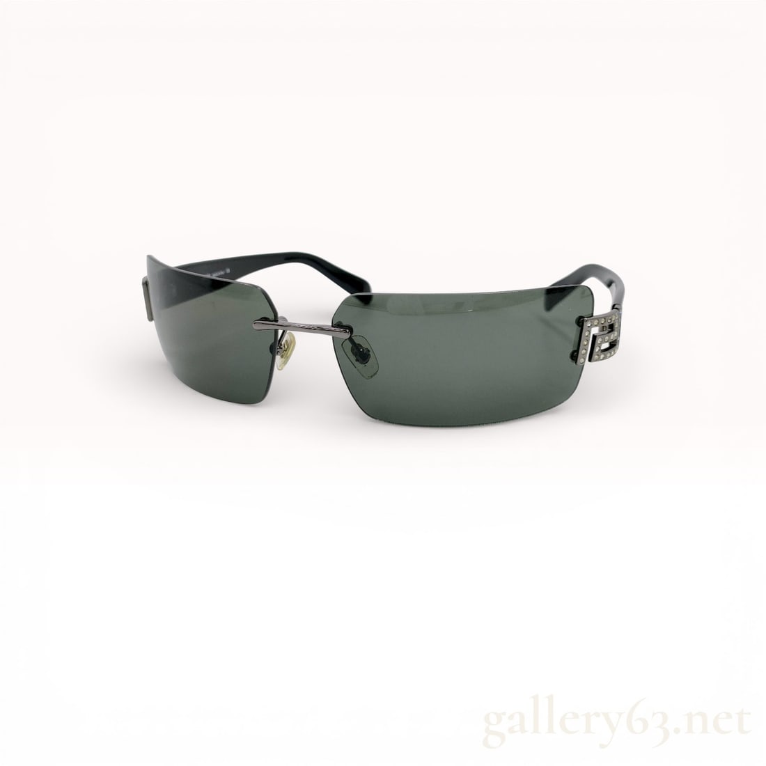 Versace Rimless Rhinestone Logo Sunglasses 1001/71, Size 64 -14-120, With Case: Authentic Versace sunglasses in dark green rimless lenses with black temples. The rectangular lenses are mounted with a minimalist bridge and adjustable nose pads. Each temple is accented with a rhine
