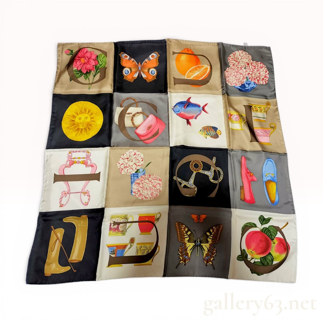 Gucci "Icons" Silk Scarf, With Box: Authentic Gucci silk scarf from the “Icons” series, featuring a patchwork-style composition of graphic motifs and still-life illustrations arranged in a grid format. The design incorporates Gu