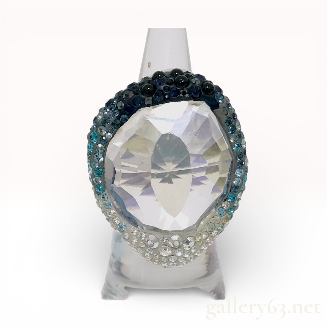 Swarovski Oversized Crystal Dome Ring with Pavé Accents size 6: Swarovski ring featuring an oversized faceted clear crystal centerpiece in a bold dome setting. Mounting accented by pavé-set crystals in graduated tones along the perimeter. Band finished