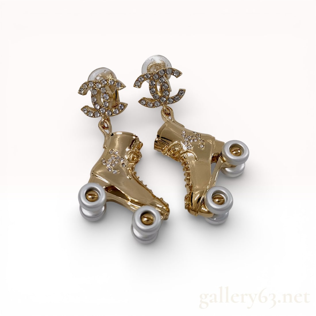 Chanel C24C Gold-Tone Roller Skate Drop Earrings, Like New with Box & Pouch: Chanel C24C Gold-Tone Roller Skate Drop Earrings with Rhinestone CC Logos Corrected Description Chanel drop earrings featuring roller skate motifs in gold-tone metal with sculptu
