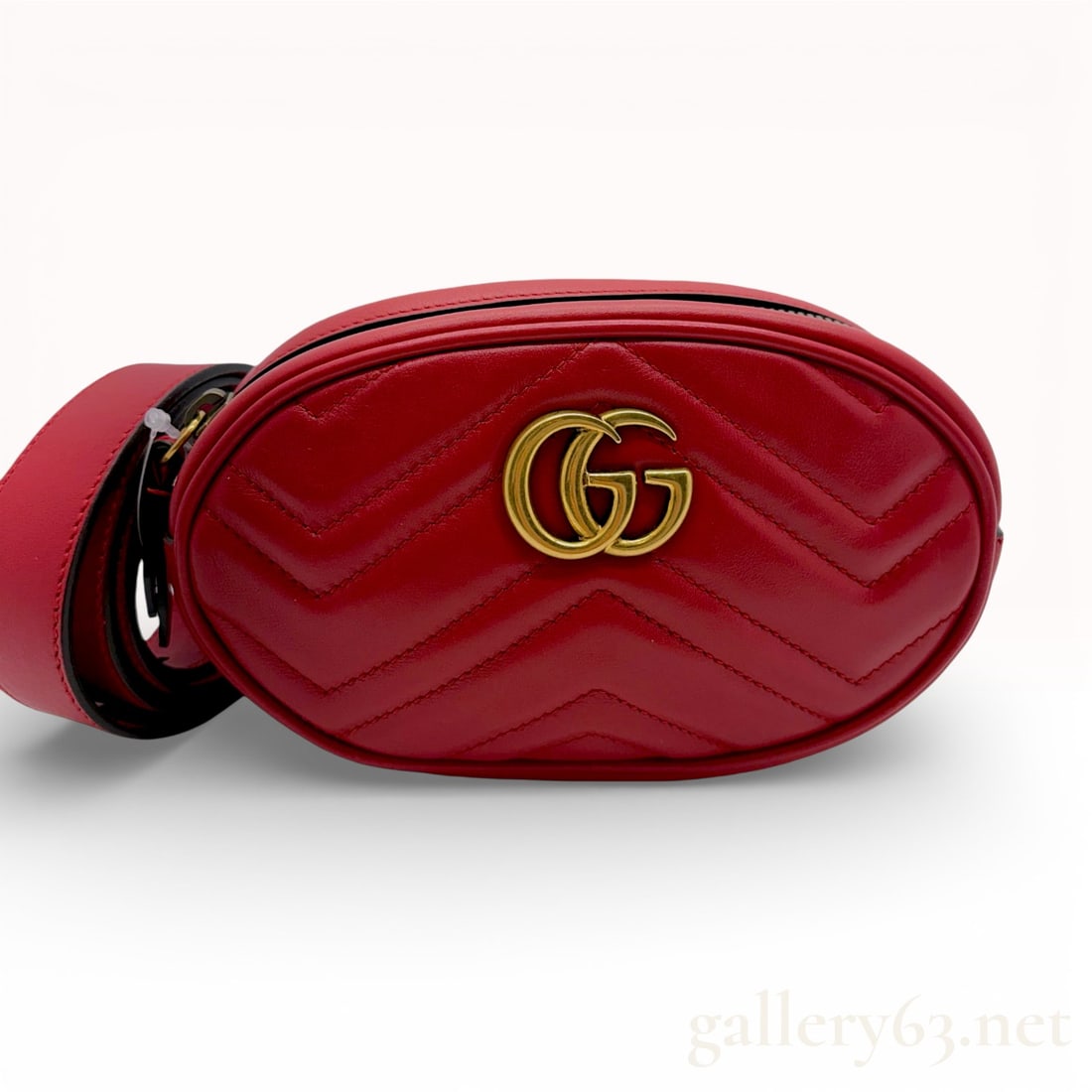 Gucci GG Marmont Red Matelassé Leather Waist Belt Bag Featuring Gold-Tone Double G Hardware: Classic Gucci Marmont belt bag, and this red colorway with the chevron quilting is so strong. Gucci GG Marmont matelassé leather waist belt bag featuring an oval silhouette in red chevron-quilted lea