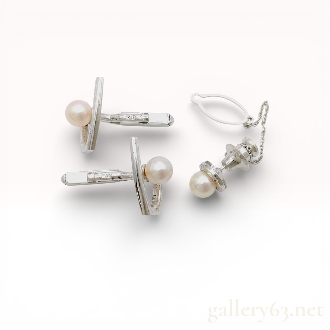Mikimoto Sterling Silver 7.2-7.4mm Akoya Pearl Tie Pin and Cufflink Set: Authentic Mikimoto Sterling silver tie pin and cufflink set featuring round Akoya cultured pearl accents. Cufflinks having polished silver bar backs with single pearl terminals. Tie pin designed with
