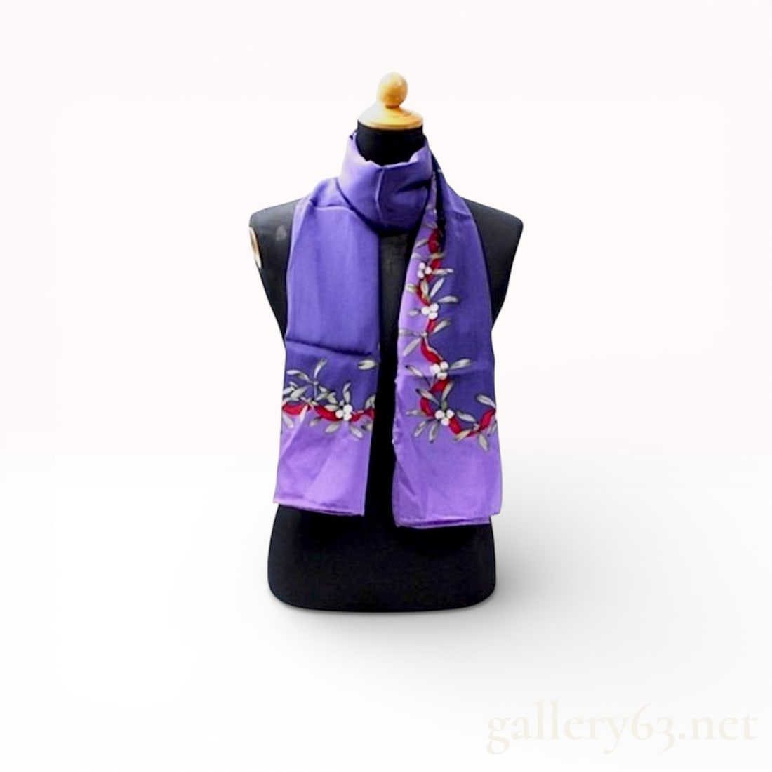 Christian Dior Floral Print Silk Scarf in Purple with Tag: Christian Dior silk scarf featuring a purple ground with floral and vine motif accents along the ends. Design having multicolor botanical detailing with soft red, green, and white elements. Scarf