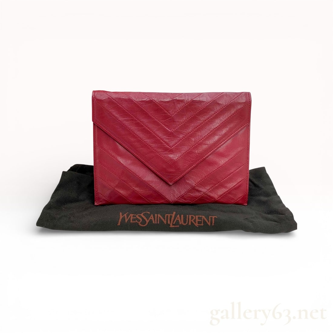 Vintage Yves Saint Laurent V-Stitch Red Leather Envelope Bag lwith Box: Vintage YSL envelope clutch in deep red leather with chevron V-stitch quilting. Large triangular flap front, snap closure. Slim rectangular profile. Top zip compartment and interior in YSL logo jacqua