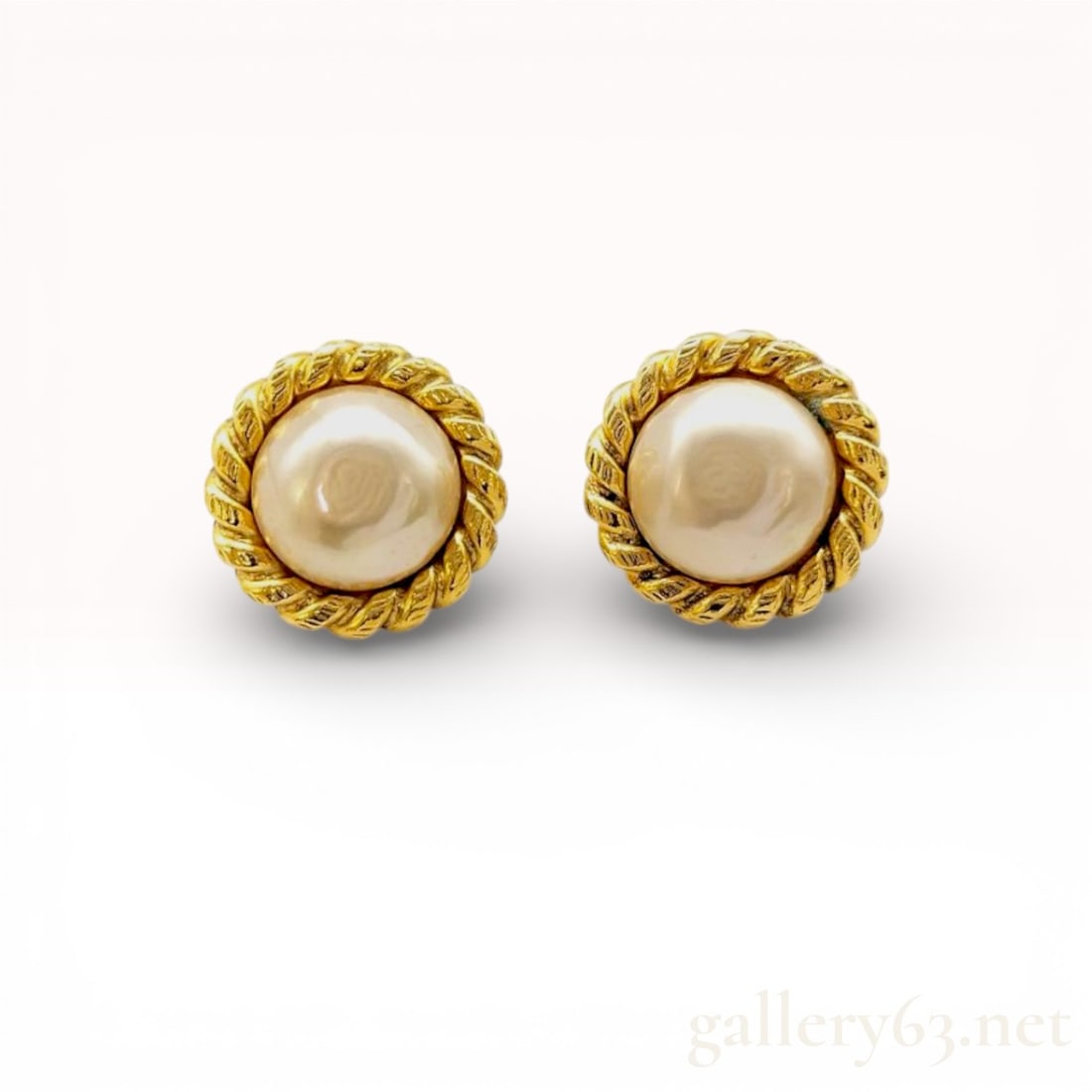 Vintage Chanel Earrings 2362 with Box: Authentic Chanel earrings featuring round faux-pearl centers set within twisted gold-tone rope borders. Clip backs featuring 2362 hallmark and Chanel logo plate Gold-tone surfaces featuring light