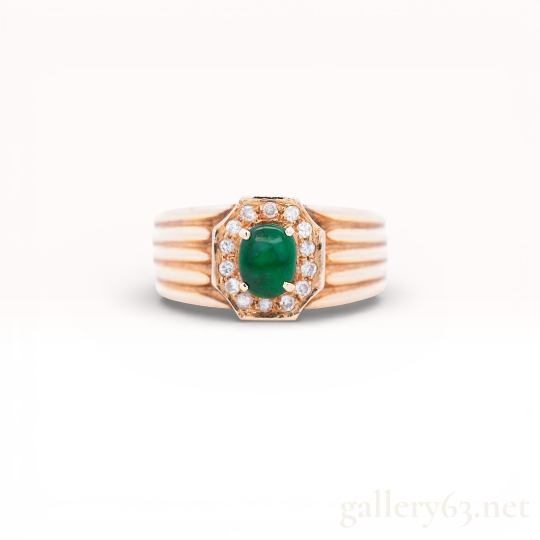 18KYG Jade & Diamond Octagon Halo Ring, 7.5: 18K yellow gold ring weighing 8.1 grams with oval cabochon jadeite jade, accented by round brilliant cut diamonds. Ribbed groove shoulders taper into solid high polish shank marked 18k inside. Excelle