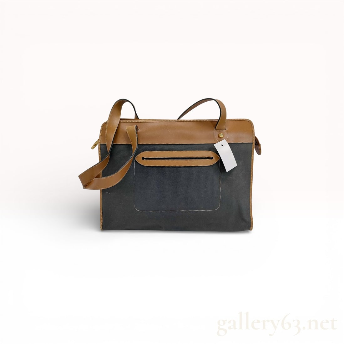 Dior Vintage Paris Spear tote bag in black canvas with tan leather trim: Dior Vintage Paris Spear tote bag in black canvas with tan leather trim and top edge; rectangular structured shape with flat base; dual leather shoulder straps; gold-tone hardware including zipper and