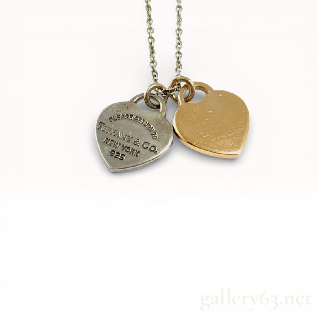 Tiffany & Co. Return To Necklace Double Heart 18k & 925 Necklace: Tiffany & Co. Return To Necklace Double Heart 18k & 925 Necklace. 16.5 inch length chain. 18k gold heart and a 925 sterling heart on a 925 silver chain. All original Tiffany and co. 