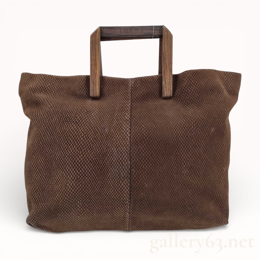 Vintage Loewe Brown Python Leather Handbag w/ Wooden Handles: Authentic rare and vintage Loewe brown python leather handbag with mahogany wood sculpted modernist handles. This bag can not be purchased anywhere online besides Gallery 63. I have looked for a compa