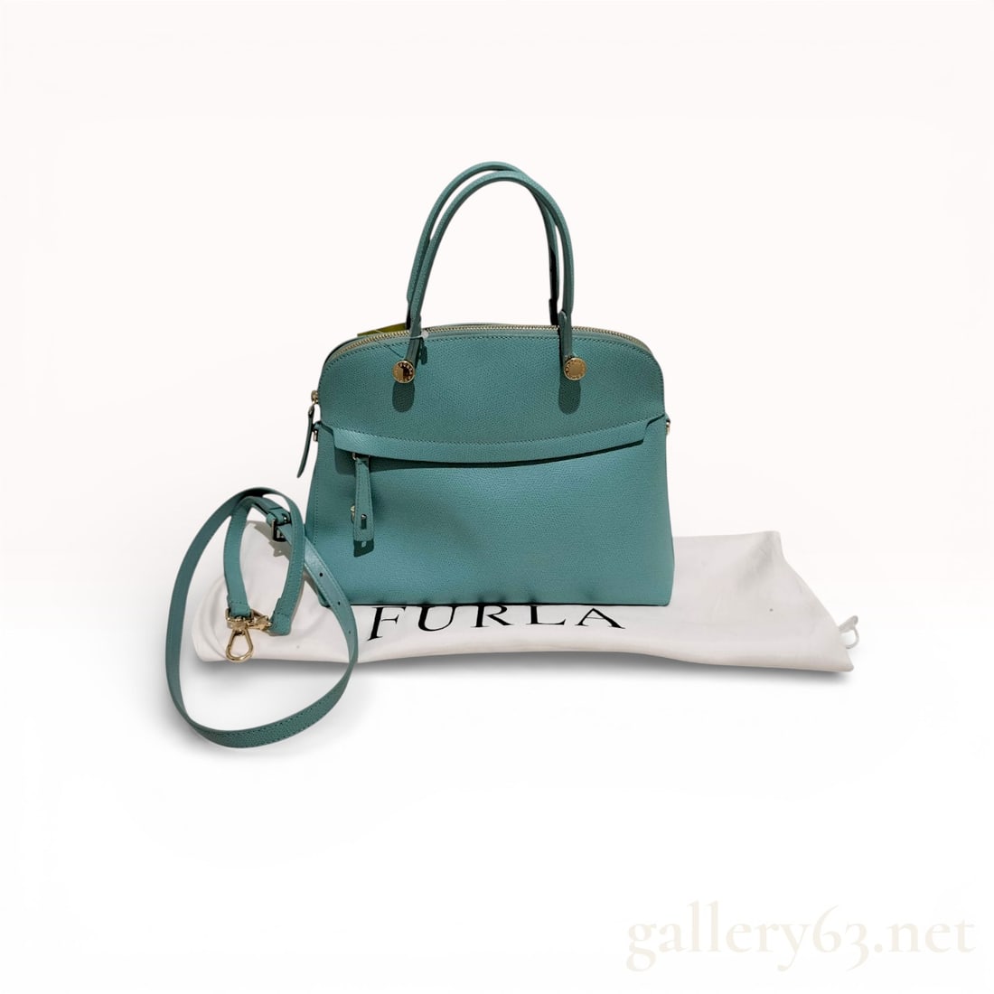 Furla Turquoise Blue Leather Piper Dome Satchel 2 Way Bag: Authentic Furla medium Piper dome satchel bag in light blue leather. Turquoise blue leather construction with 2 way shoulder and top handle. Matching blue canvas interior. Comes with dust jacket. 