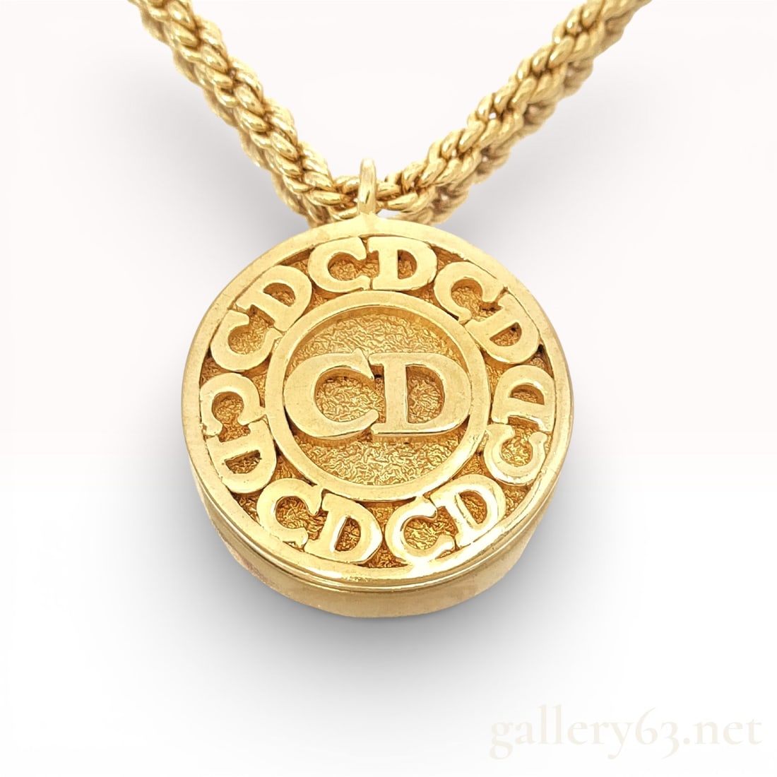 Vintage Dior Christian Dior Gold-Tone Necklace 18": Vintage Dior Gold-tone necklace with a thick rope chain and a large round pendant. Pendant showing raised repeating “CD” logo around outer ring and larger “CD” at center. Rope chain fi