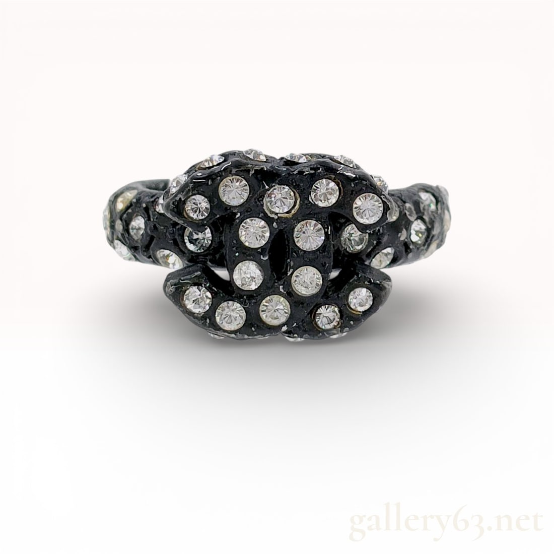 Chanel Vintage 2002 Autumn Black CC Logo Rhinestone Ring sz 7: Authentic Chanel 02A collection ring crafted in black metal with a raised double “C” logo encrusted in clear rhinestones. Dome-shaped design with additional rhinestone accents around the