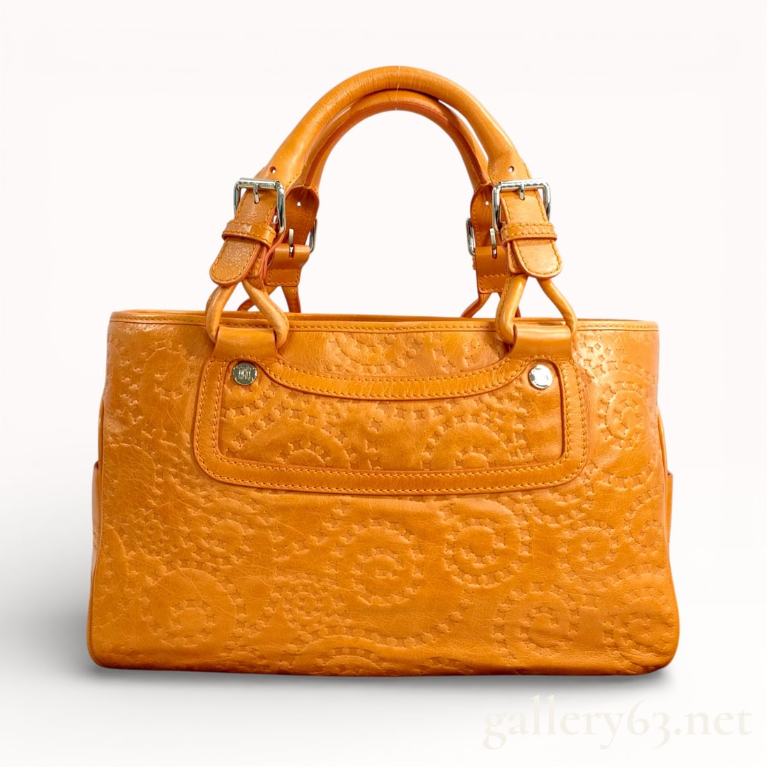 Celine Triomphe Embossed Leather Boogie Bag: Authentic Celine Boogie handbag crafted in warm tan leather, embossed throughout with the Triomphe motif. Structured silhouette featuring rolled top handles secured with leather tabs and metal hardwar