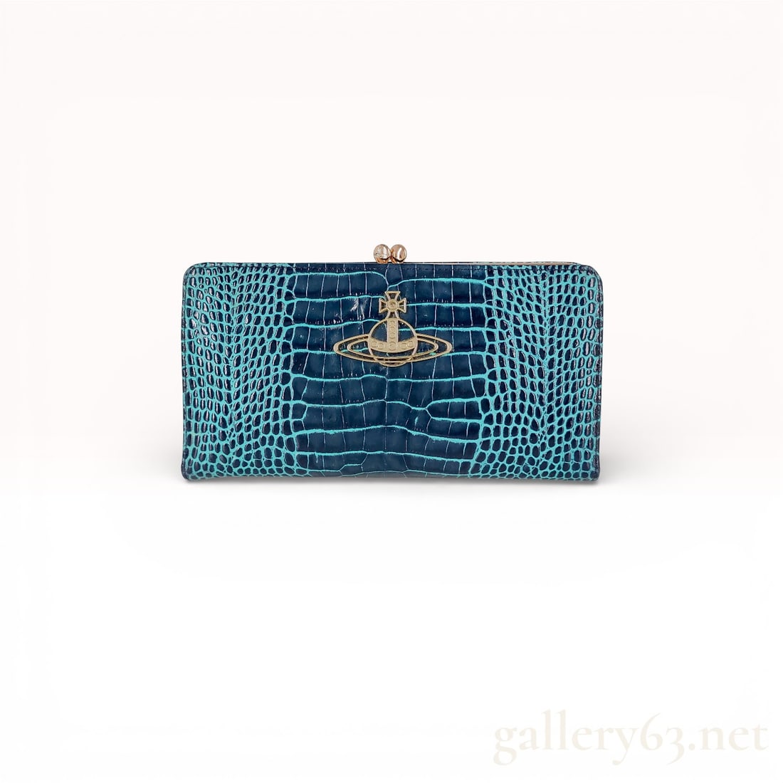 Vivienne Westwood Long Wallet in Teal and Navy Blue Croc-Embossed Leather: Vivienne Westwood long wallet in teal and navy blue croc-embossed leather featuring gold-tone metal Orb logo on front and clasp closure. Interior lined in gray fabric with multiple card slots, compart