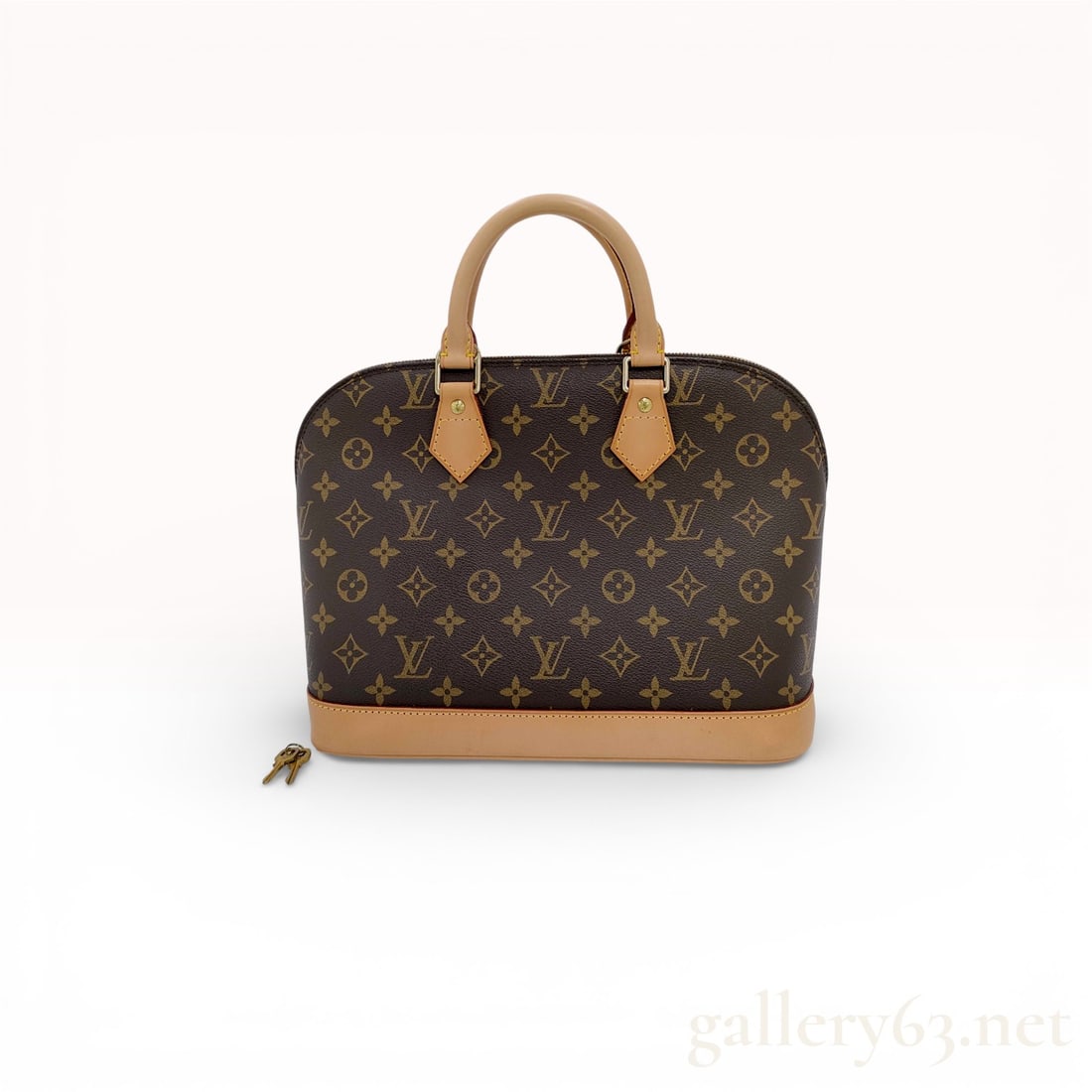 Louis Vuitton Alma Handbag Monogram Coated Canvas & Leather: Authentic Louis Vuitton Alma handbag in coated canvas and leather. This bag is in excellent condition. Comes with padlock and matching key. 