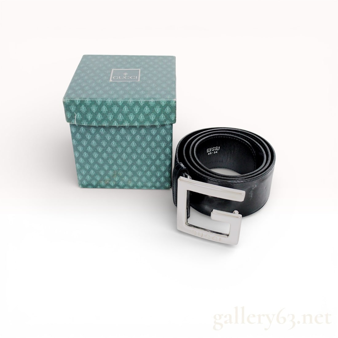 Gucci Black Leather Belt with G Buckle: Authentic Gucci Black Leather Belt with G Buckle. Belt featuring black leather with a wide strap and a polished silver-tone G-shaped buckle. Strap interior marked Gucci and Made in Italy. Belt comes