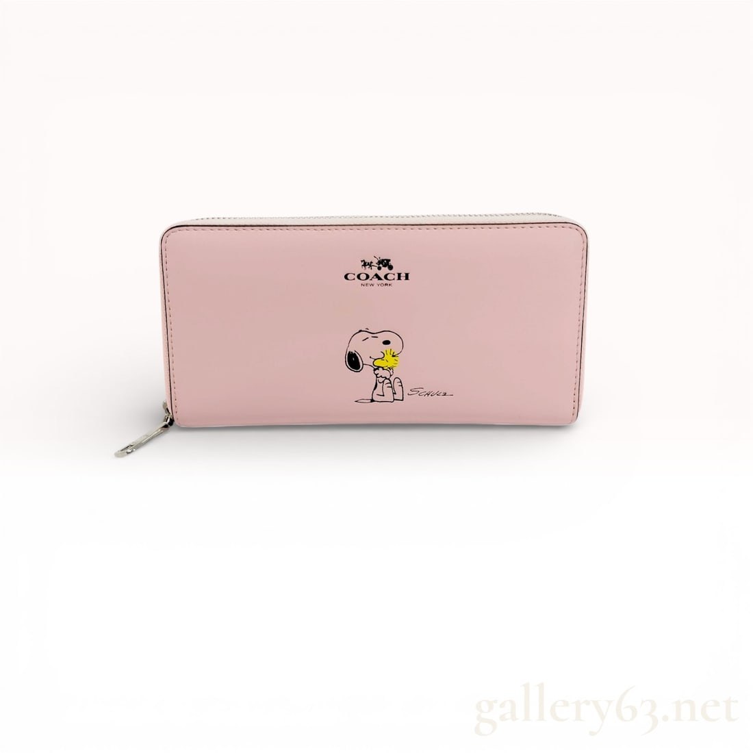 Coach x Peanuts Long Zip Around Wallet in Light Pink Leather - Excellent Condition: Authentic Coach x Peanuts Long Zip Around Wallet in light pink leather with a Snoopy and Woodstock print.