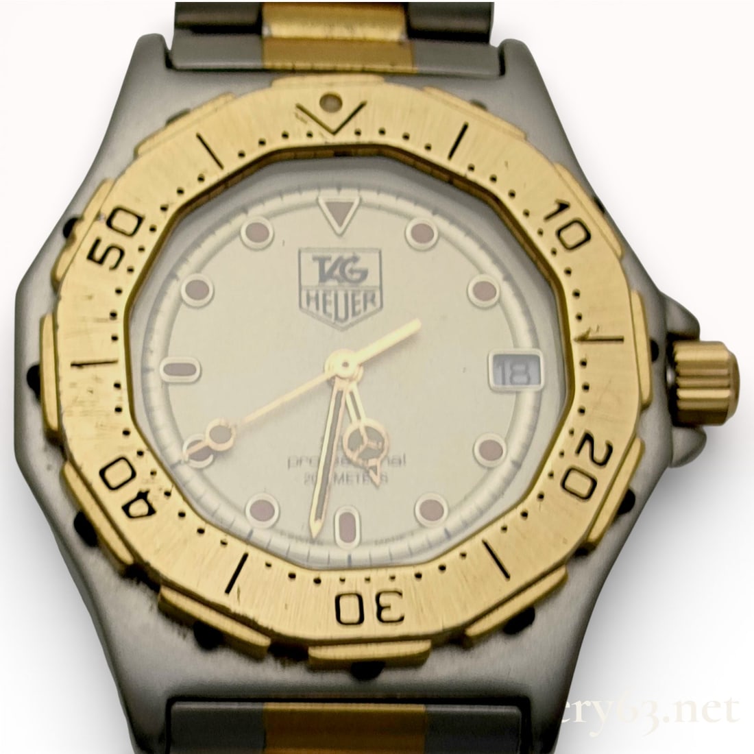 TAG Heuer 935.413 Two-Tone Stainless Steel Quartz Watch 32mm: Tag heuer watch, authentic. 32mm. stainless steel case with gold-tone rotating bezel marked with engraved numerals and minute indicators. silver dial with luminous dot hour markers and gold-tone hands