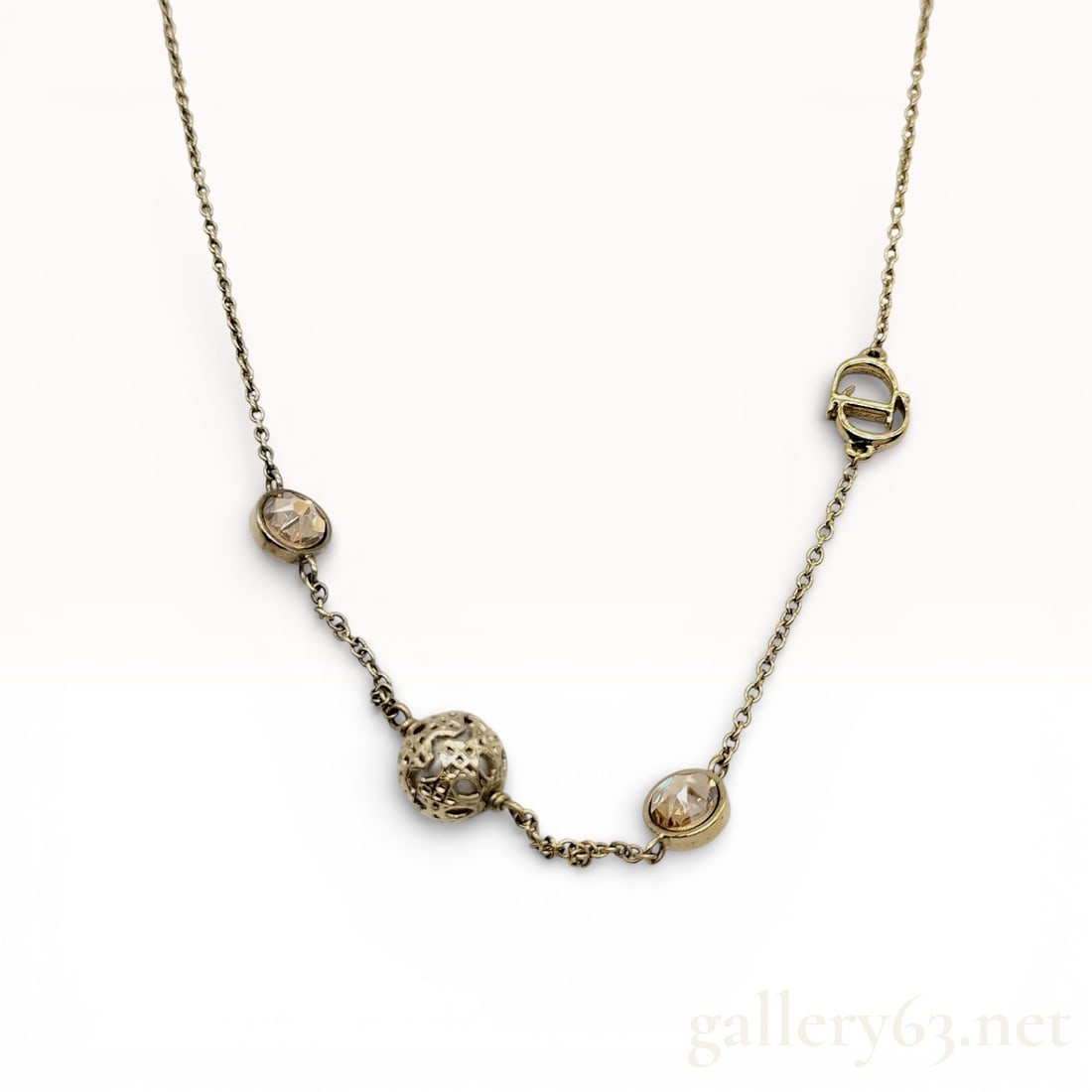 Christian Dior Secret Cannage Station Necklace: Authentic Christian Dior gold-tone metal Secret Cannage station necklace featuring faux pearls, crystals, and a signature CD logo detail. between 16 and 18"