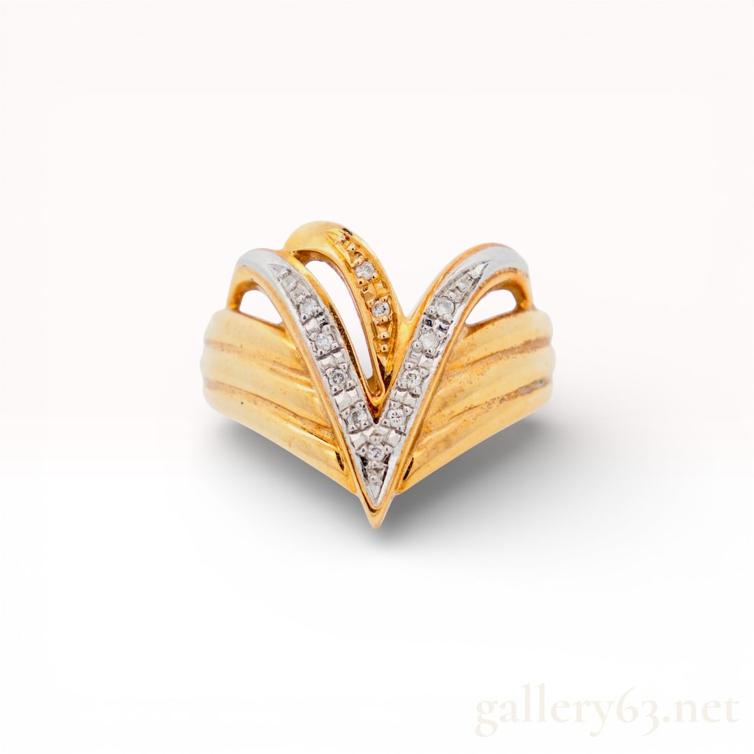 18K Yellow Gold Vintage Diamond Ring, 7: Solid 18k yellow gold diamond ring. Mid-century chevron cocktail ring with fluted winged shoulders. Bright-cut pave in platinum with high-polish yellow gold ribs. Total Gold Value: (USD - U.S. Dolla