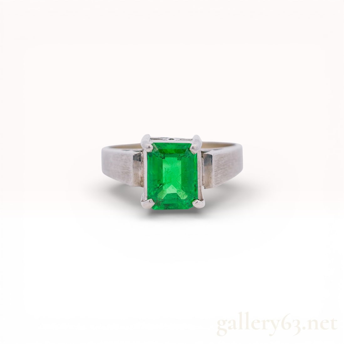 Pt850 Emerald-Cut 2.00ct Emerald Solitaire Ring, Size 6: Rectangular emerald-cut green emerald, tested, set in a four-prong solitaire mounting of solid PM850 platinum. The flat, tapering shank shows a prior sizing seam on the underside; total weight 5.5 g.&