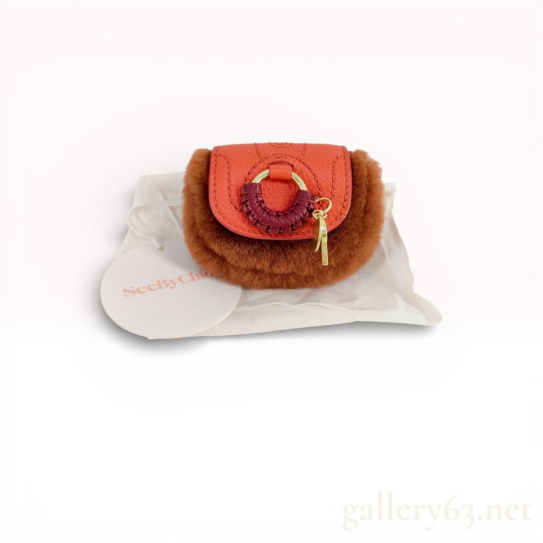 See by Chloé Fur Tag Coin Pouch with Dust Bag new with Tag: Authentic See by Chloé Fur Tag Coin Pouch with Dust Bag Mini coin pouch in brown faux fur with rounded body. Coral/orange grained leather flap top. Gold-tone ring hardware and braided leather